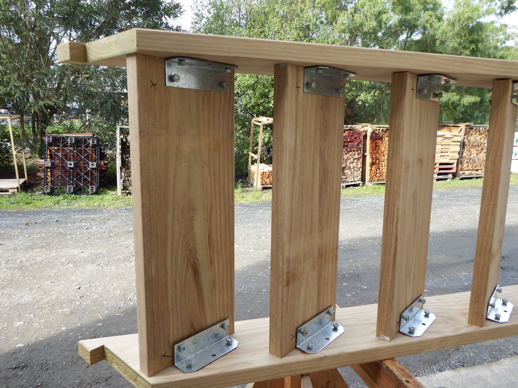 Place the other stringer on top of the treads and loosely attach nuts